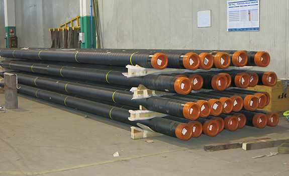 Stockpile of pipes that have been pre-wrapped with Premcote 1500 in Italy